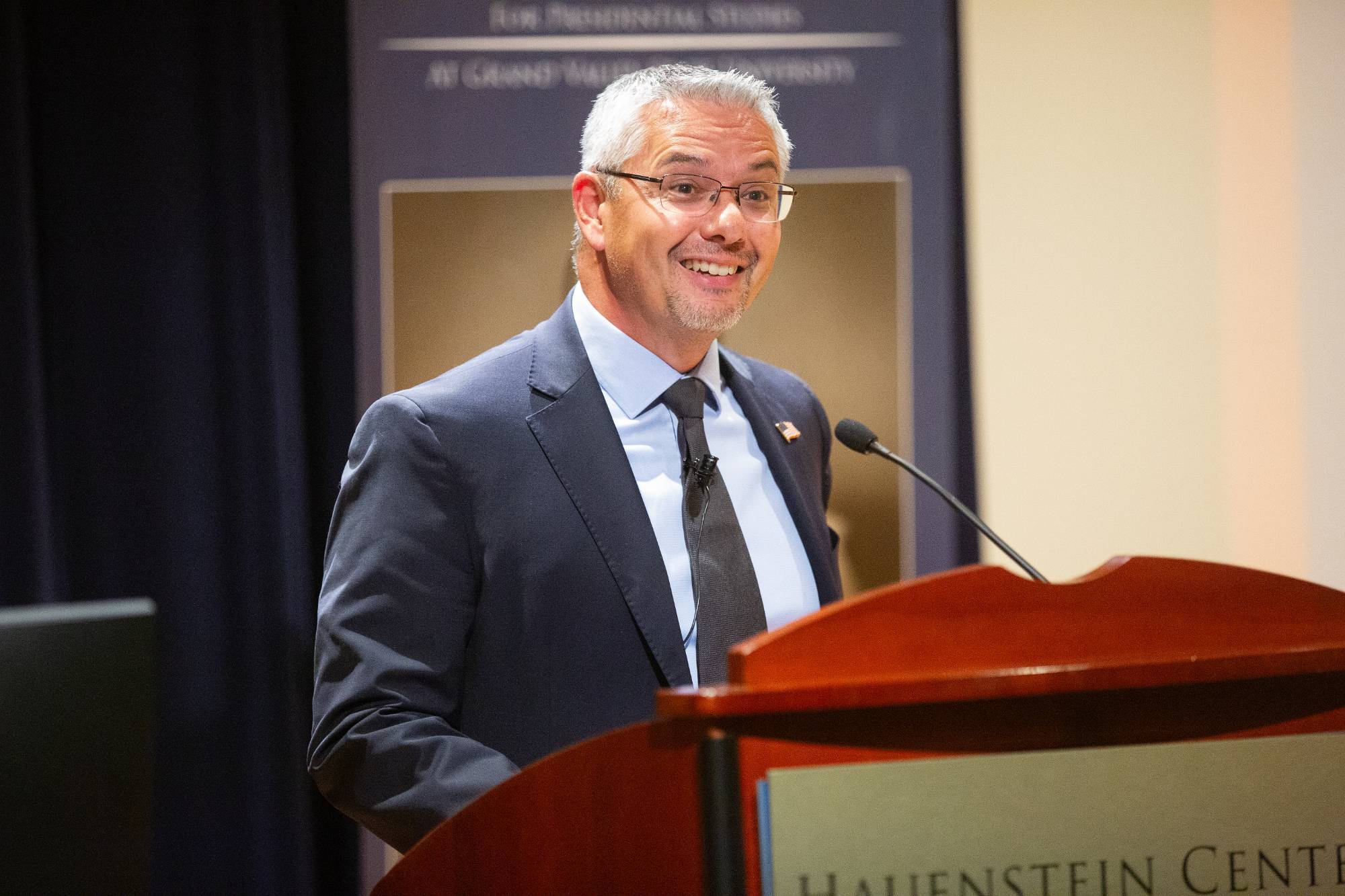 person speaking at a podium